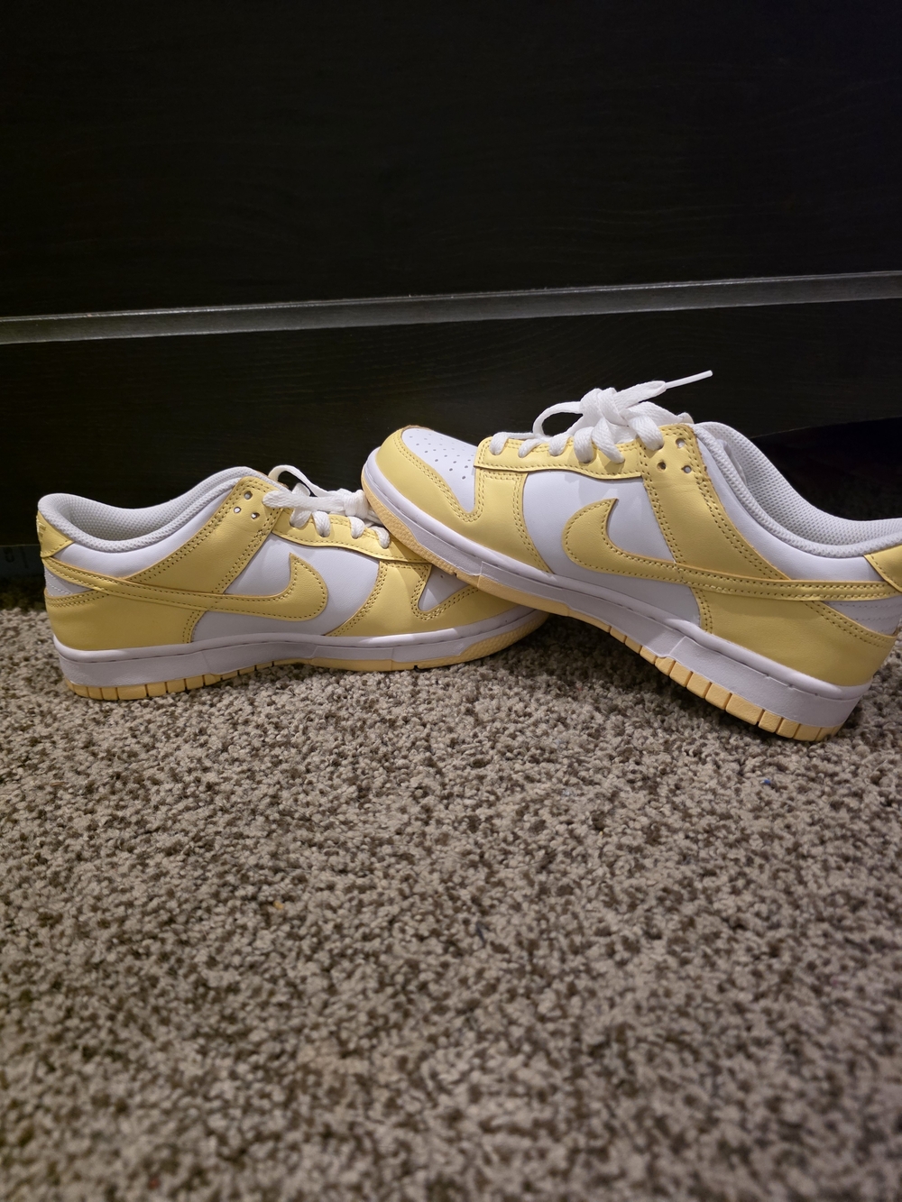 Nike Dunk Low GS sneakers in the White/Soft Yellow colorway, code FB9109-126.